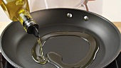 Olive oil being added to a pan