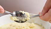 Sweet semolina dumplings being made