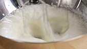Whipping cream until stiff using an electric whisk