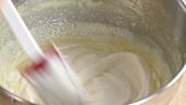 Folding whipped cream into crème