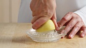 Squeezing half a lemon
