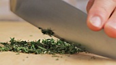 Herbs being chopped