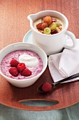 Porridge with fresh raspberries and sweet polenta with grapes