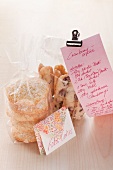 Coconut cookies with cranberry stems in cellophane bags for gift giving