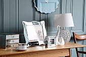 Table lamp & ornaments on side table
