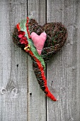 Decorative heart against wooden background