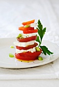 Tomato and feta tower with spring onions and parsley