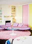 Designer couch with pink leather upholstery in a living room