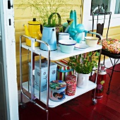 Metal containers and tin cans and on a vintage-style tea trolley