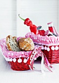 Red wicker baskets with lined with pink, polka dot fabric