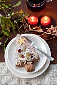 Iced Christmas tree cake, mistletoe and candles