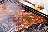 Marinated spare ribs on a grill