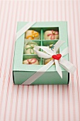 Heart-shaped white chocolates in gift box
