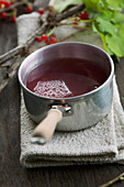 Redcurrant syrup in a pot