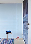 Bauhaus stool in front of designer fitted wardrobe