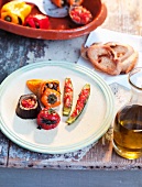 Stuffed vegetables, olive oil, baguette