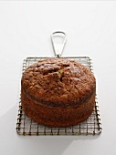 Round zucchini bread on a wire kitchen rack