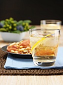 Port tonic cocktail, almonds and prosciutto