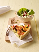 A slice of asparagus-leek quiche and salad