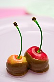 Two cherries -- dipped in chocolate