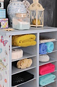 Colorful hand towels in a half-high bookcase