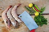 Jumbo shrimp, chili peppers, herbs, lemons and cleaver