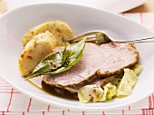 Roast pork with caraway, bread dumplings and white cabbage