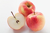 Halved apple and whole apples (variety: Jonagold)