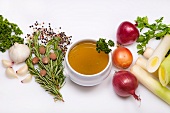 Soup bowl of vegetable stock and ingredients