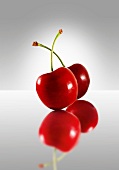 Two cherries on a glass plate