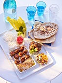 Falafel, pita bread, kebabs and salad