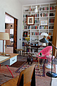 Library with tall bookcases and fifties-style desk