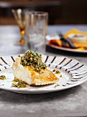 Grilled fish with anchovy and herb sauce