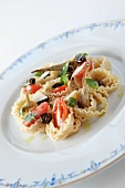 Tagliatelle with sword fish, tomatoes, olives and basil