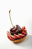 A strawberry and cherry tartlet