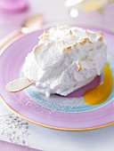 An ice cream on a sick with a meringue topping