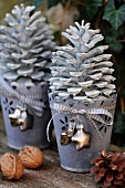 Advent decor: white pine cones in zinc flowerpots