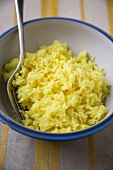 Bowl of Saffron Rice with a Fork