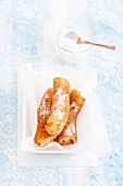 Porras (Spanish fritters) with icing sugar