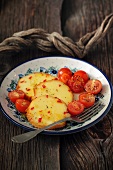 Sheep's cheese fried in honey with cherry tomatoes