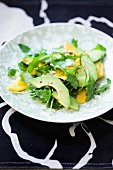 Rocket salad with mango and avocado