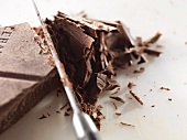 Knife Cutting Dark Chocolate Bar
