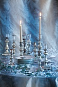 Crockery and silver candlesticks