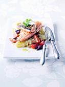 Sea trout with potatoes, tomatoes and olives
