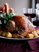 Roast turkey with potatoes for Christmas dinner