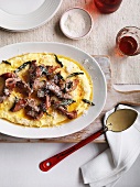 Veal escalope with ham and sage on polenta