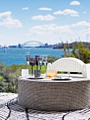 Upholstered seat with a backrest serving as a table and a bridge model serving as a table lamp