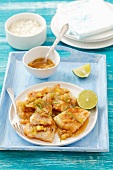 Fried cod with garlic, ginger and limes