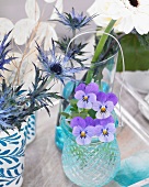 Centrepiece with gerberas, roses, violas and sea-holly