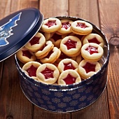 Shortbread jam-filled biscuits in a biscuit tin